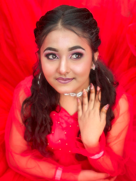 Beautiful woman posing with red background.