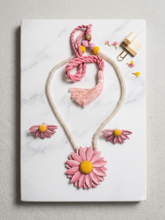 GARIMAS handmade pink daisy clay necklace and matching floral earrings with yellow centres, pearl-look beads and pink tie cord.