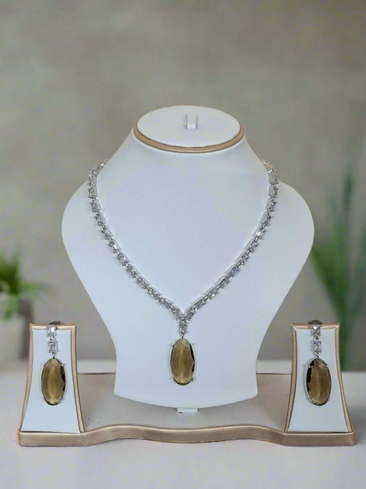 Silver-plated necklace set with aqua and yellow stones and American Diamond-style accents by GARIMAS.