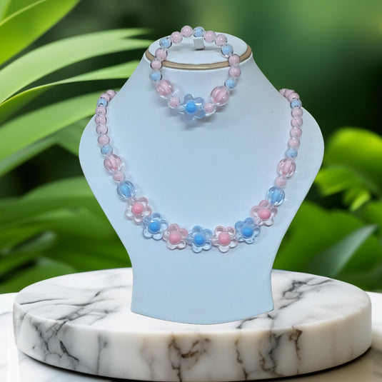 Beaded necklace and bracelet set on a stand