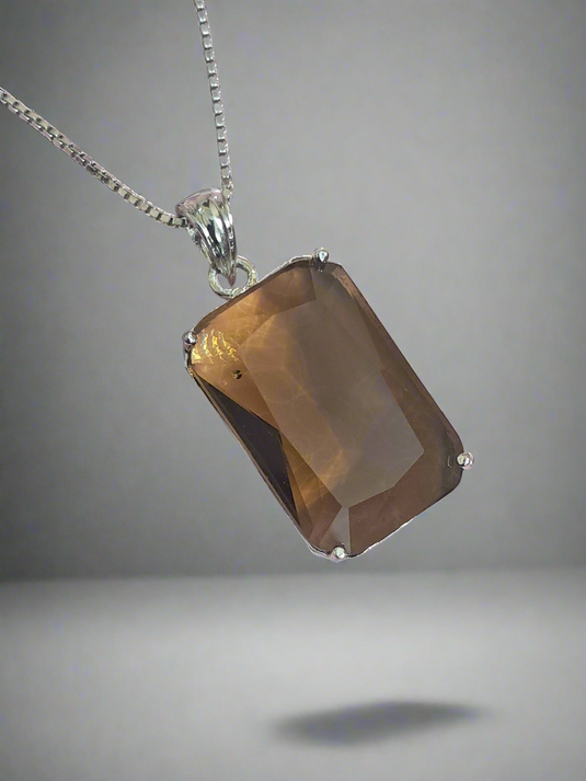 Garimas smoky yellow pendant necklace with silver plating, featuring a rectangular CZ stone centerpiece.