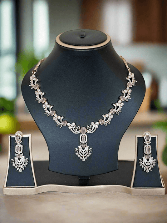 Rose-gold plated necklace set with American Diamond-style stones and a pink centre stone by GARIMAS.