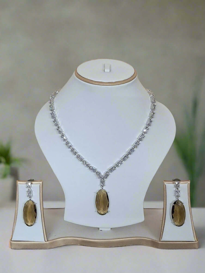 Silver-plated necklace set with aqua and yellow stones and American Diamond-style accents by GARIMAS.