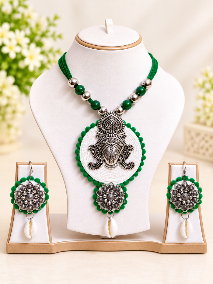 GARIMAS green and silver-tone ethnic necklace set with round pendant and matching earrings